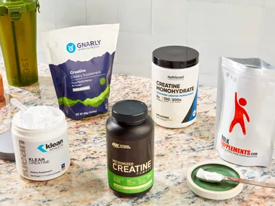 5 creatine supplements on marble countertop