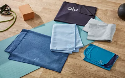 6 yoga towels on floor with yoga accesories