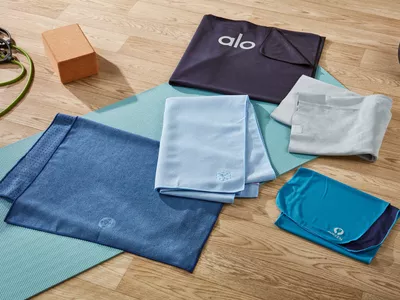 6 yoga towels on floor with yoga accesories