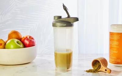 Contigo Shake & Go Thermalock Bottle displayed with smoothie, scoop, and fruit