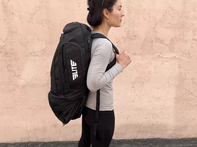 Person wearing the Elite Convertible Gear Gym Bag & Backpack on their back