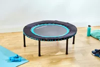 The Leaps and Rebounds Mini Fitness Trampoline and Rebounder in a fitness room