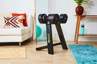 MX55 Rapid Change Adjustable Dumbbells on stand in living space 