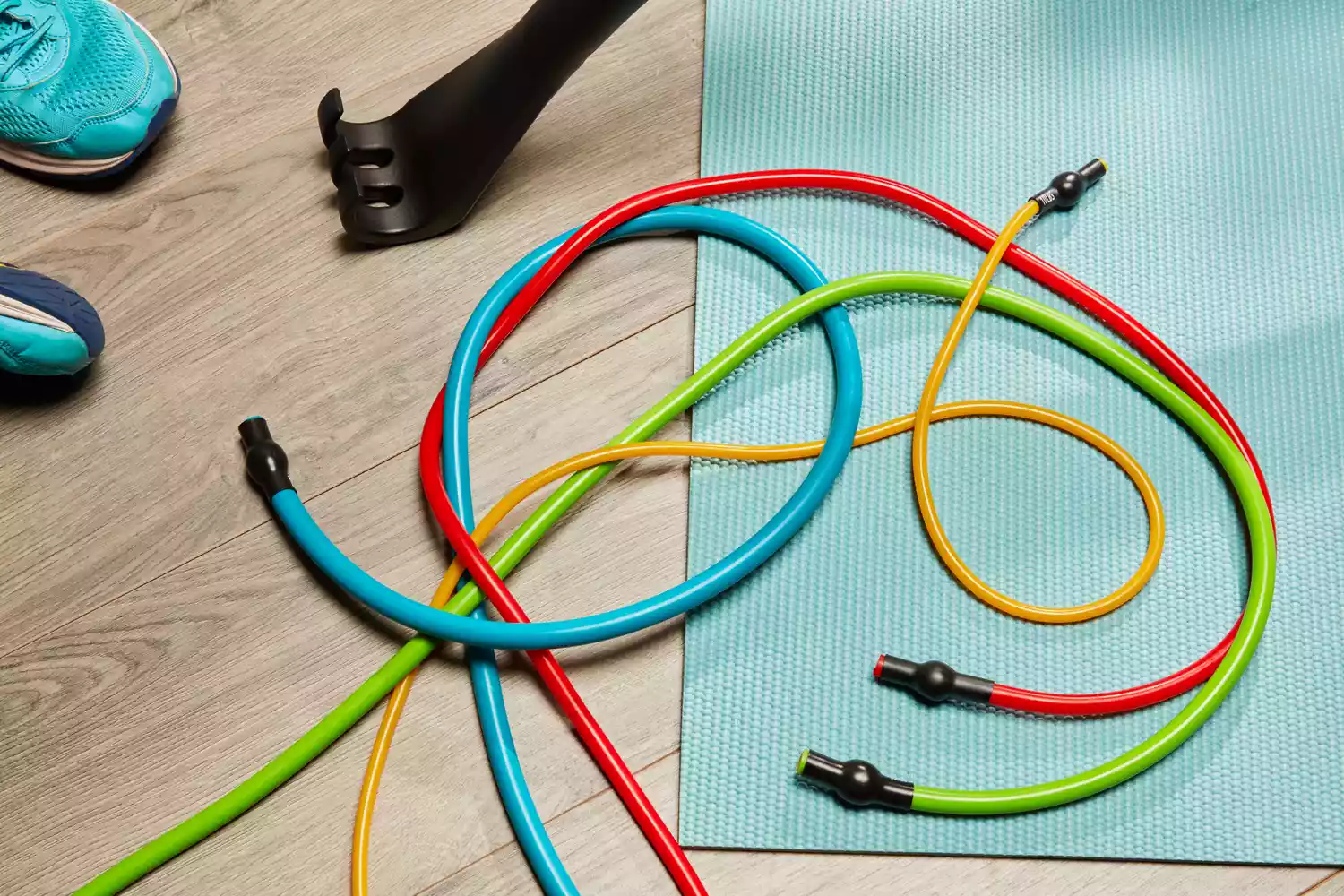 Resistance bands from Gorilla Bow The Original Total Bundle on a yoga mat