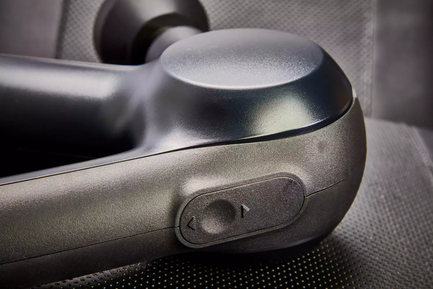 Closeup of power switch on Therabody Theragun Prime (4th Generation)