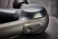 Closeup of power switch on Therabody Theragun Prime (4th Generation)