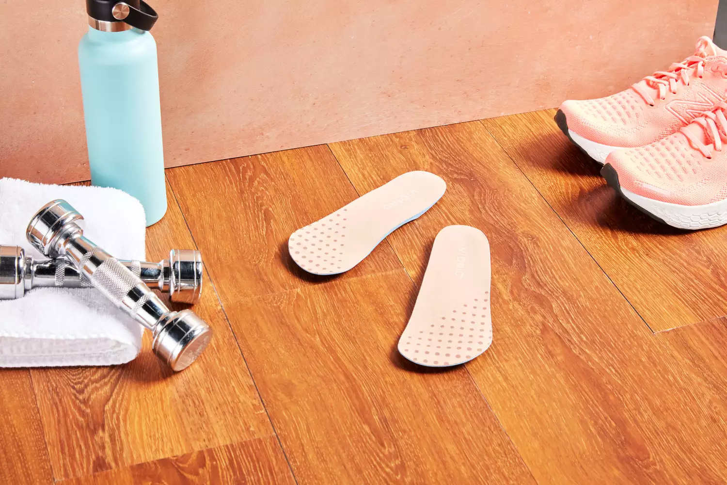Vionic Slimfit Orthotic Insoles displayed on a wood floor