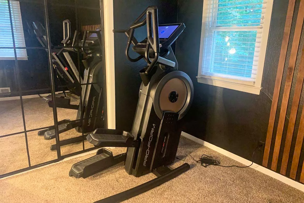 The ProForm Cardio HIIT H14 Trainer in a carpeted room
