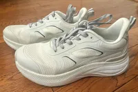 A pair of Propét DuroCloud 392 Women's Sneakers on a wooden floor