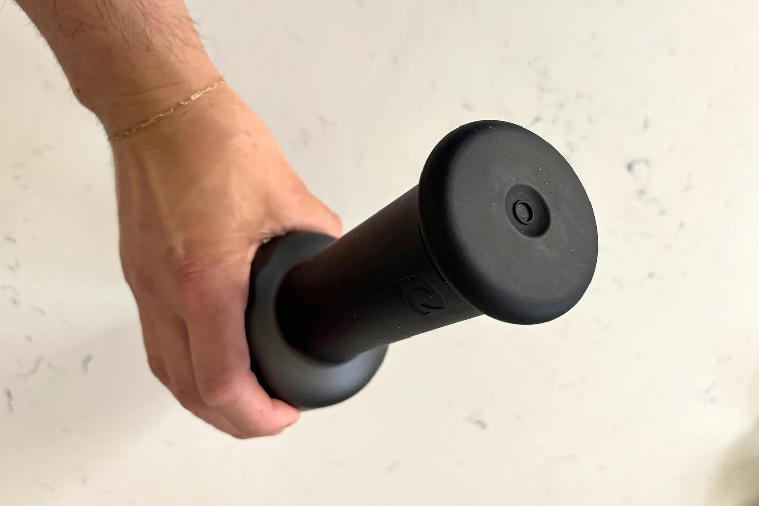 The handle on the Rally Massage Gun