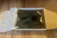 The Hoka Restore TC Recovery Shoes in the box
