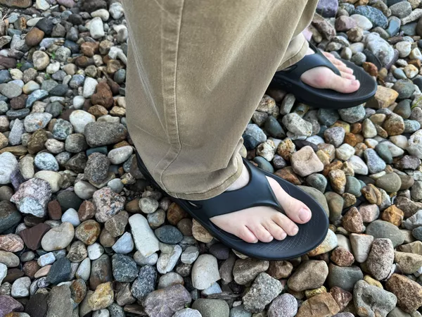 Oofos OOriginal Sandals worn on rocks