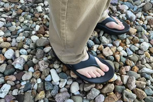 Oofos OOriginal Sandals worn on rocks