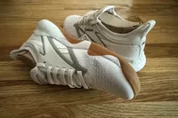 The Reebok Nano Court sneakers posed on wood