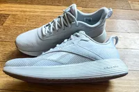 The logo on the side of the Reebok Unisex DMX Comfort+ Walking Shoes