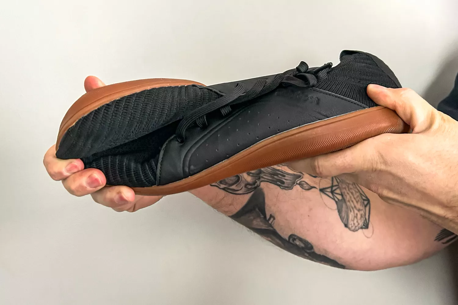 Person holding Relxfeet Men's Barefoot Shoes Minimalist Cross