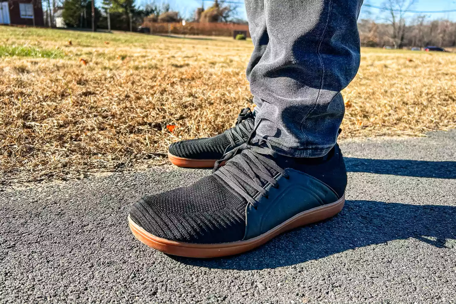 A person walks outside while wearing the Relxfeet Men's Minimalist Barefoot Shoes