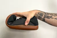 A person bends the toe of the Relxfeet Men's Minimalist Barefoot Shoe