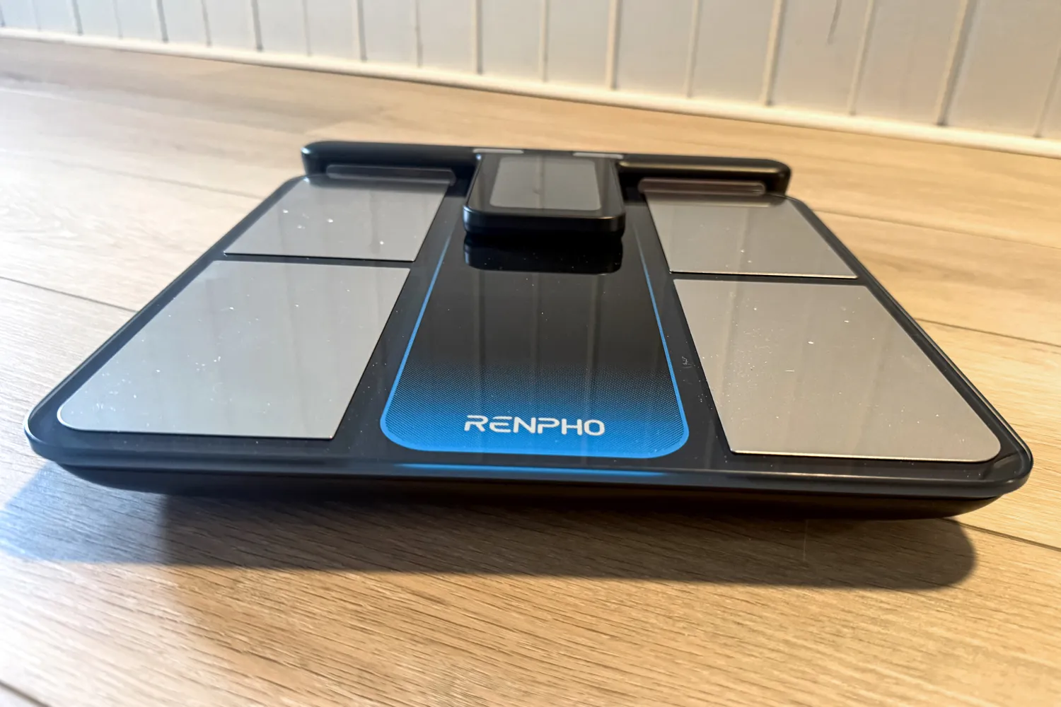 The Renpho MorphoScan Smart Body Scale on a wooden floor