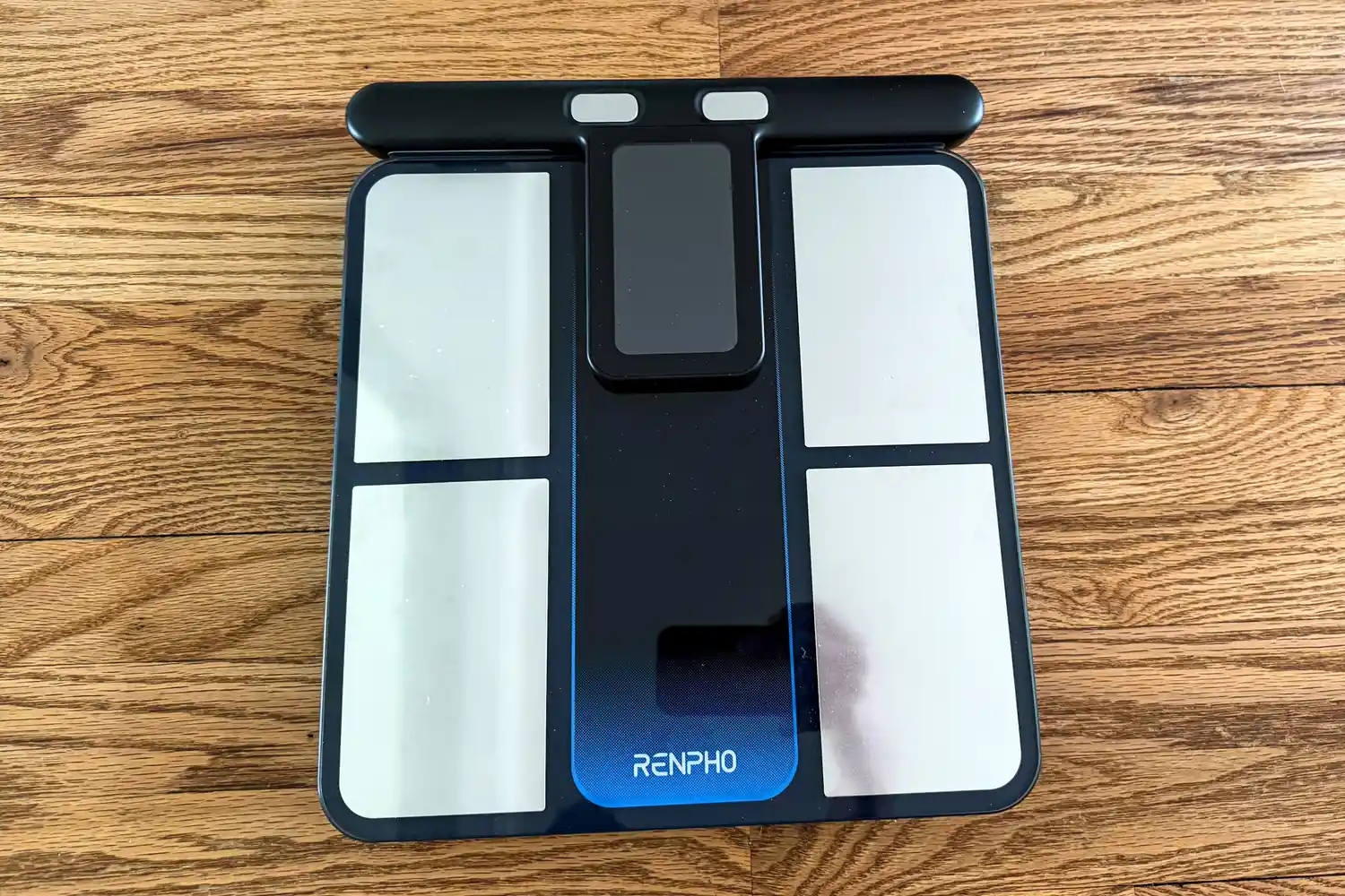 The Renpho MorphoScan Smart Body Scale on a wooden floor