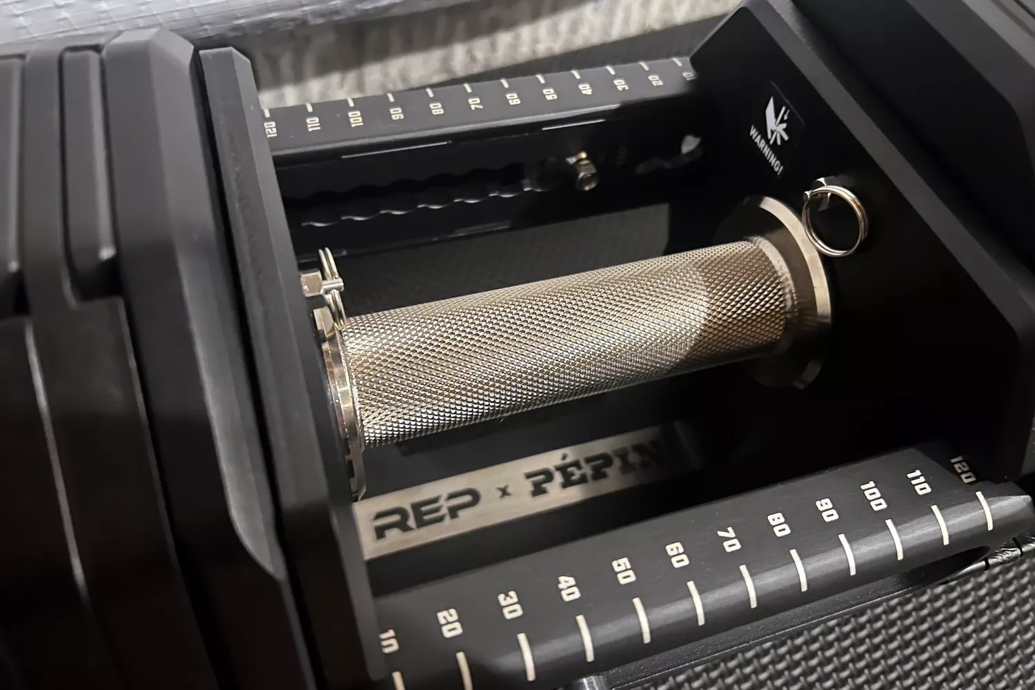 The handle on the REP Fitness REP x PÉPIN FAST Series Adjustable Dumbbell