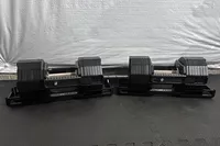 The REP Fitness REP x PÉPIN FAST Series Adjustable Dumbbell on an exercise mat