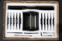 The REP Fitness REP x PÉPIN FAST Series Adjustable Dumbbell in a shipping box