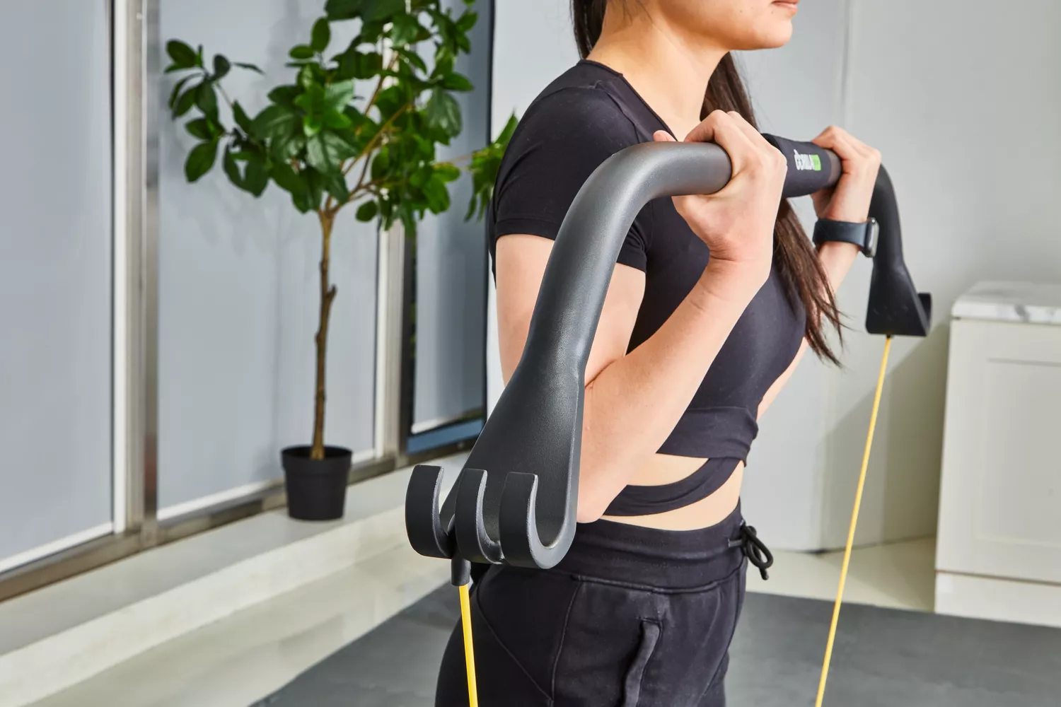 Person holding the bar from the Gorilla Bow The Original Total Bundle