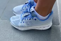 Tester from the side wearing On Running Cloudsurfer