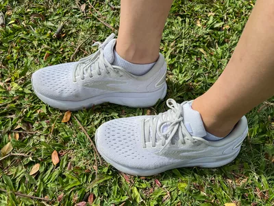 An overhead view of the Brooks Women's Ghost 16 Running Shoes in grass