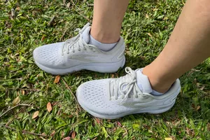 An overhead view of the Brooks Women's Ghost 16 Running Shoes in grass