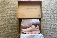 A pair of Rykä Women's Podflow EZ Walking Sneaker in a shoebox