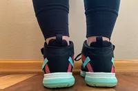 The back of a person wearing the Ryka Devotion XT Mid Top Training Shoes