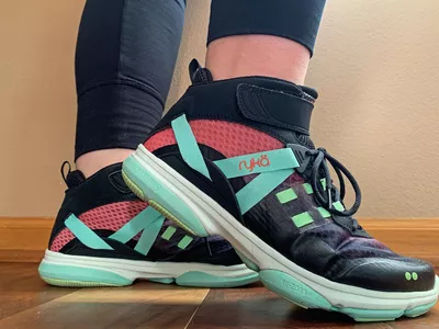 A side view of a pair of Ryka Devotion XT Mid Top Training Shoes