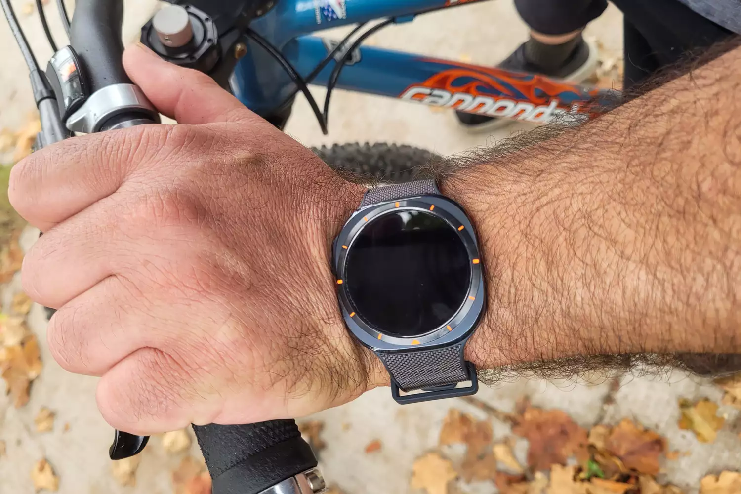 A person wears the Samsung Galaxy Watch Ultra while biking