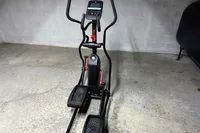 The Schwinn 411 Compact Elliptical Machine in a basement