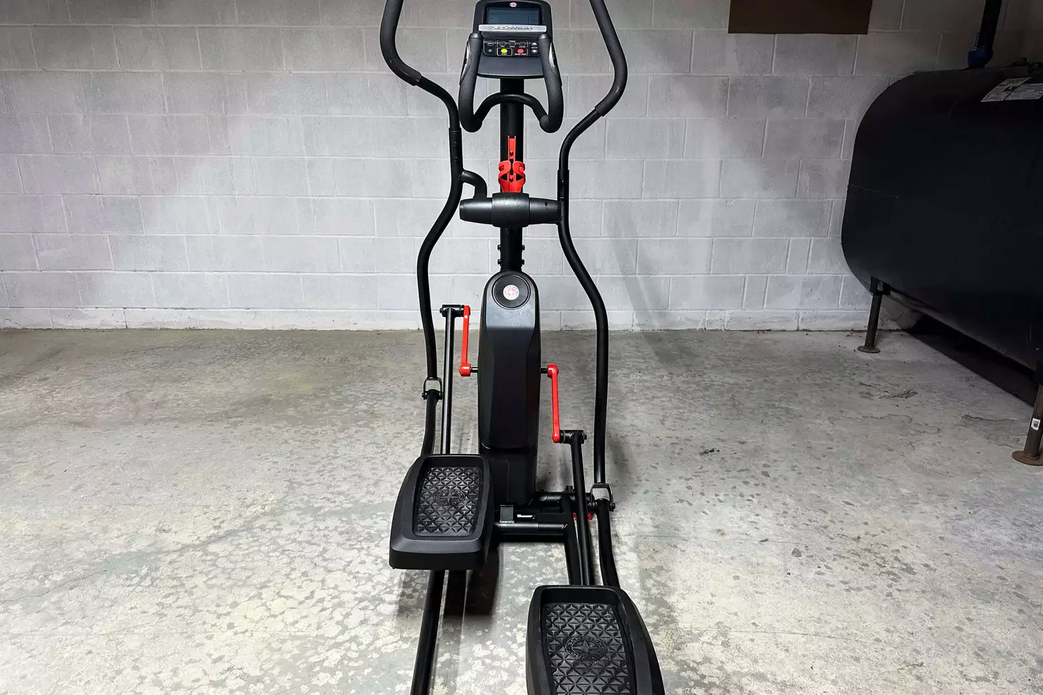 The Schwinn 411 Compact Elliptical Machine on a concrete floor