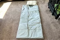 The Sharper Image Calming Heat Sauna Infrared Wrap on a carpet