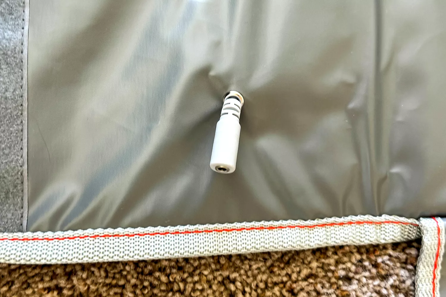 A close-up of the plug of the Sharper Image Calming Heat Sauna Infrared Wrap