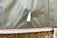 A close-up of the plug of the Sharper Image Calming Heat Sauna Infrared Wrap