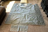 An opened Sharper Image Calming Heat Sauna Infrared Wrap on a carpet