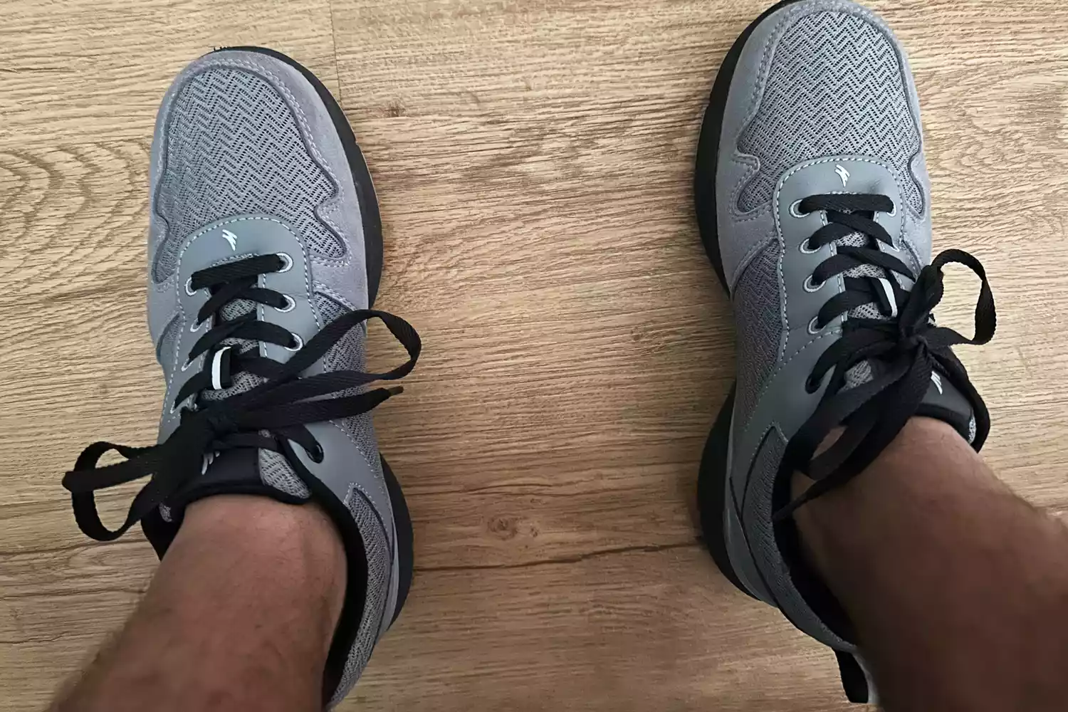 Closeup of a person wearing shoes with the Walk-Hero Comfort and Support Plantar Fasciitis Insoles inside.