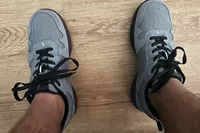 Closeup of a person wearing shoes with the Walk-Hero Comfort and Support Plantar Fasciitis Insoles inside.