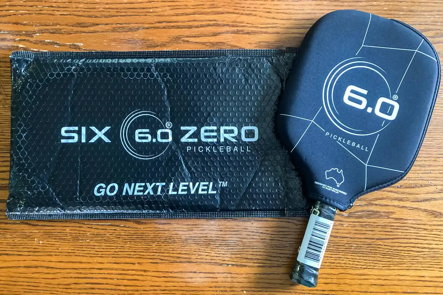 The Six Zero Double Black Diamond Control Pickleball Paddle with a cover on