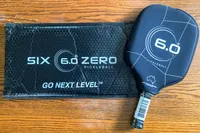 The Six Zero Double Black Diamond Control Pickleball Paddle with a cover on