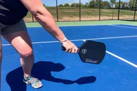 A person uses the Six Zero Double Black Diamond Control Pickleball Paddle