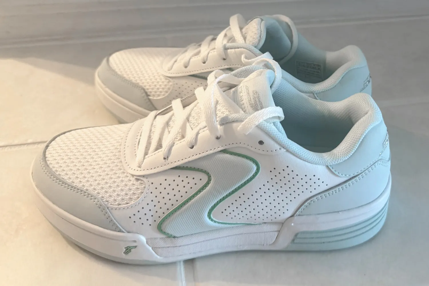 A side view of a pair of Skechers Women's Viper Court Classic Pickleball Shoes