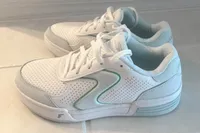 A side view of a pair of Skechers Women's Viper Court Classic Pickleball Shoes