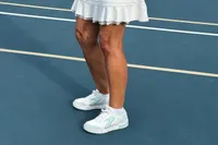 A person wears the Skechers Women's Viper Court Classic Pickleball Shoes while playing pickleball