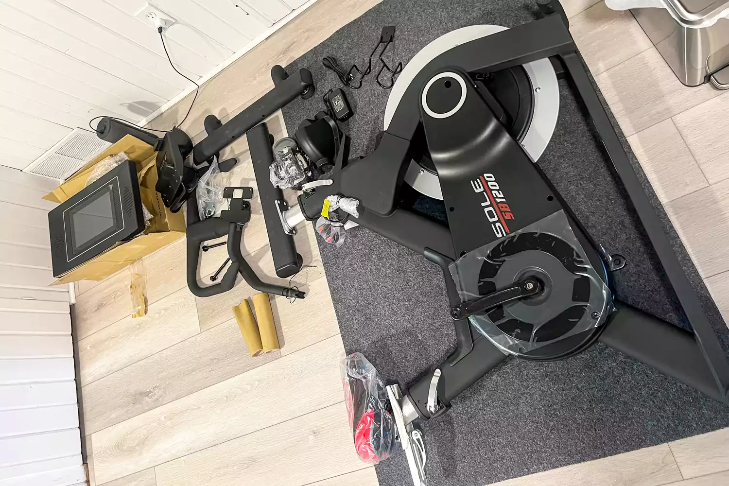 The pieces of the SOLE SB1200 Exercise Bike before assembly